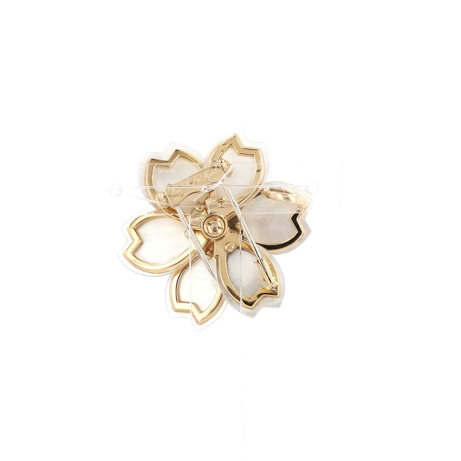 Van Cleef 
Arpels Rose de Noel small model clip in yellow gold, diamonds and mother of pearl