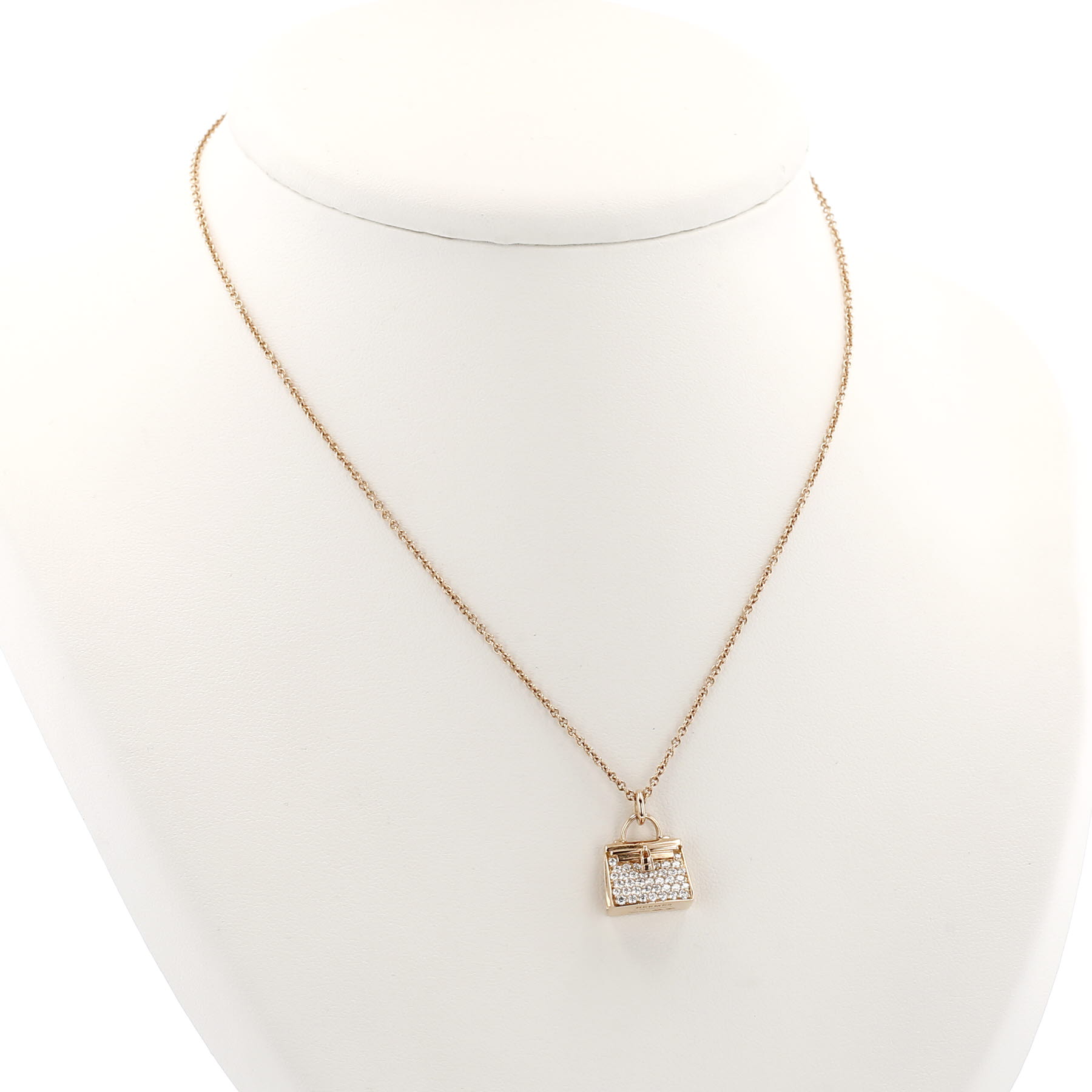 Collier Hermès Amulettes Kelly en or rose et diamants