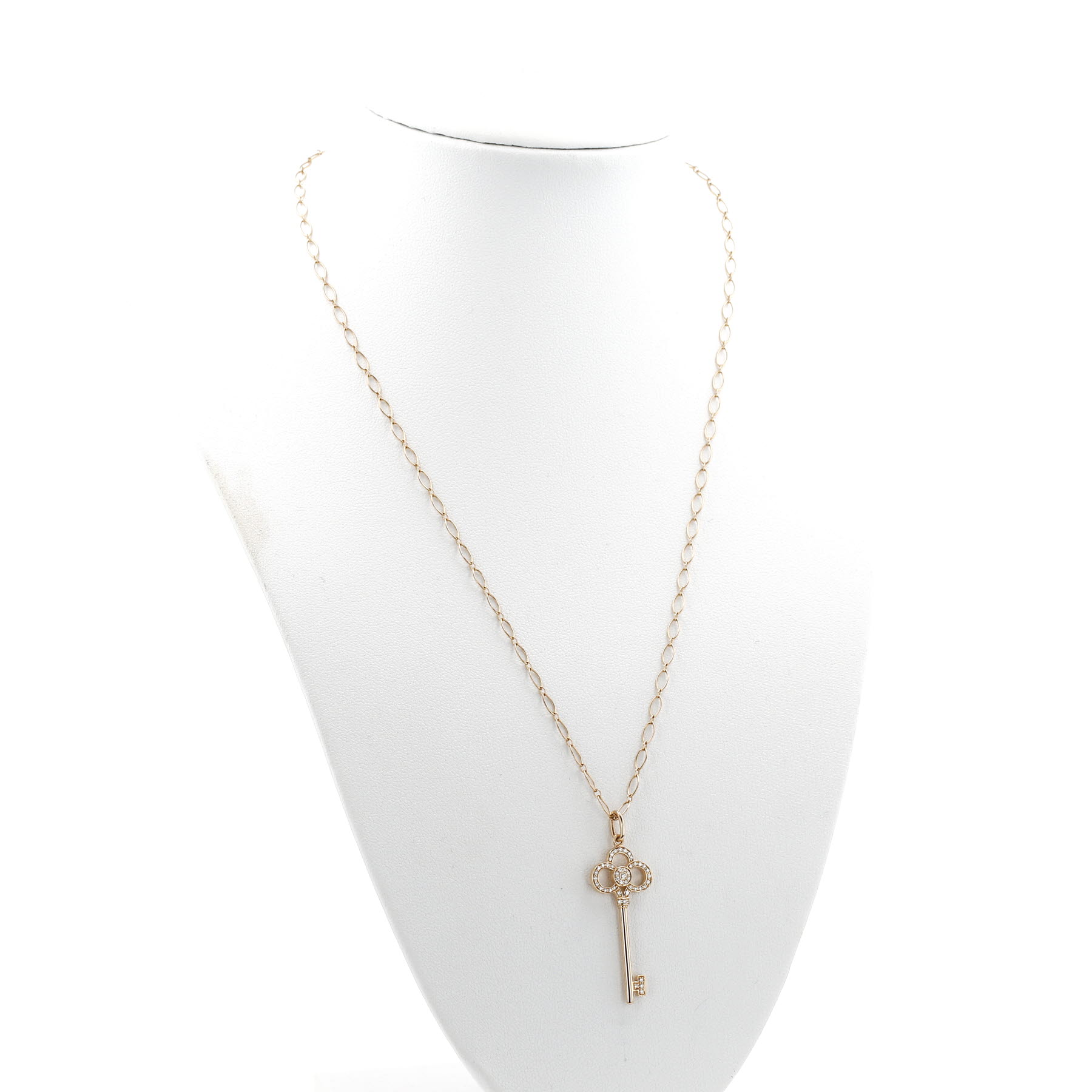 Pendentif Tiffany 
Co Clé Couronne en or rose et diamants