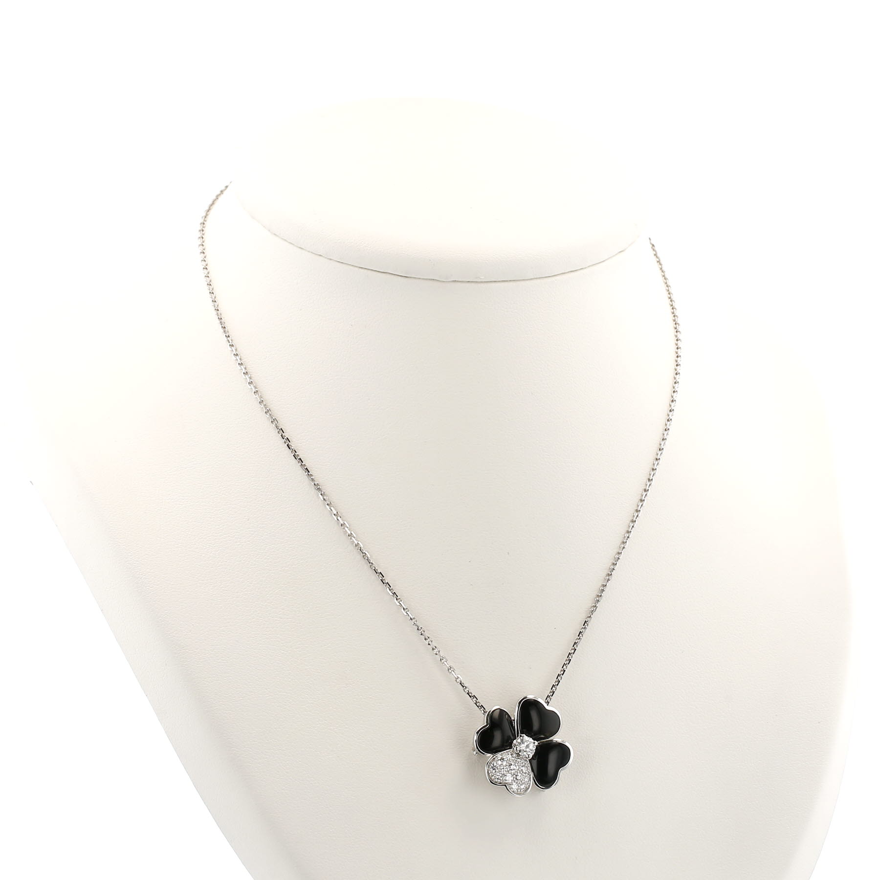 Van Cleef 
Arpels Cosmos brooch-pendant in white gold, diamonds and onyx