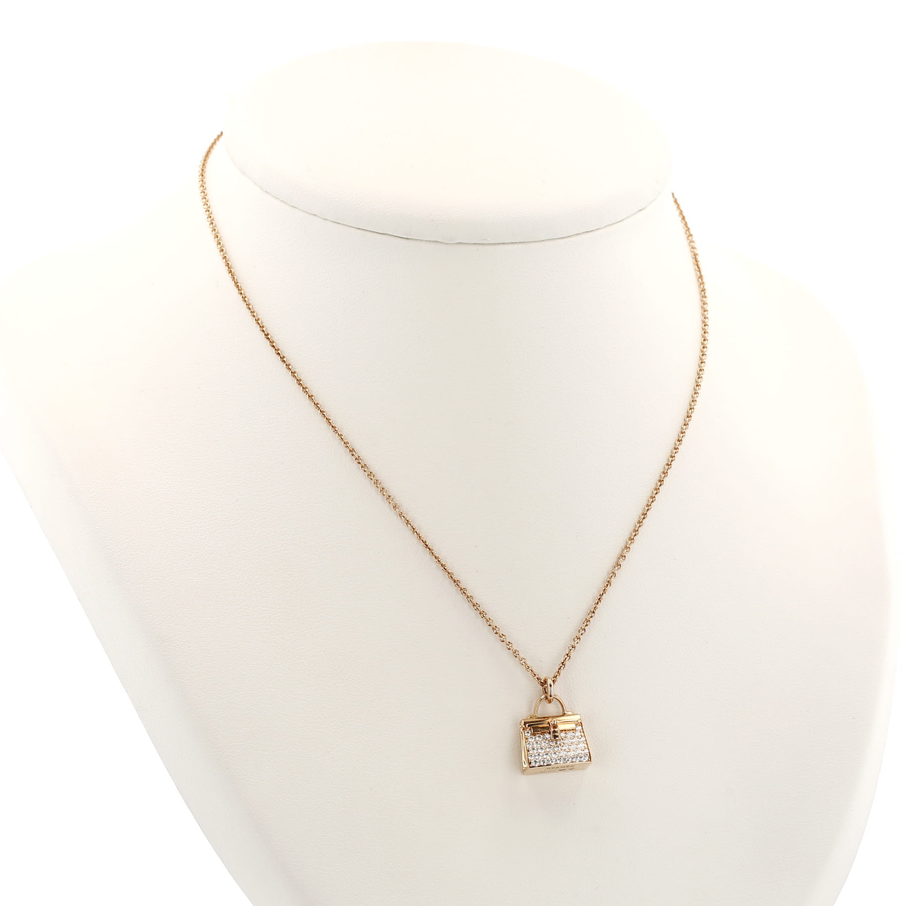 Pendentif Hermès Amulettes Kelly en or rose et diamants