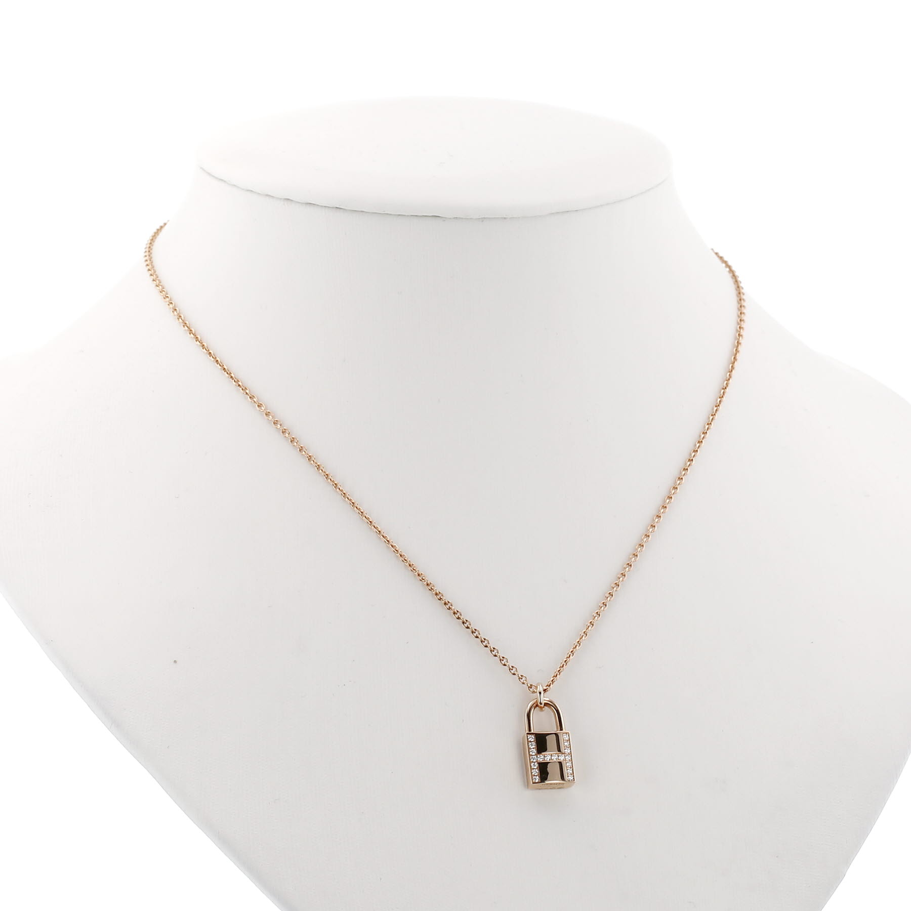 Hermès Cadenas Kelly pendant in pink gold and diamonds