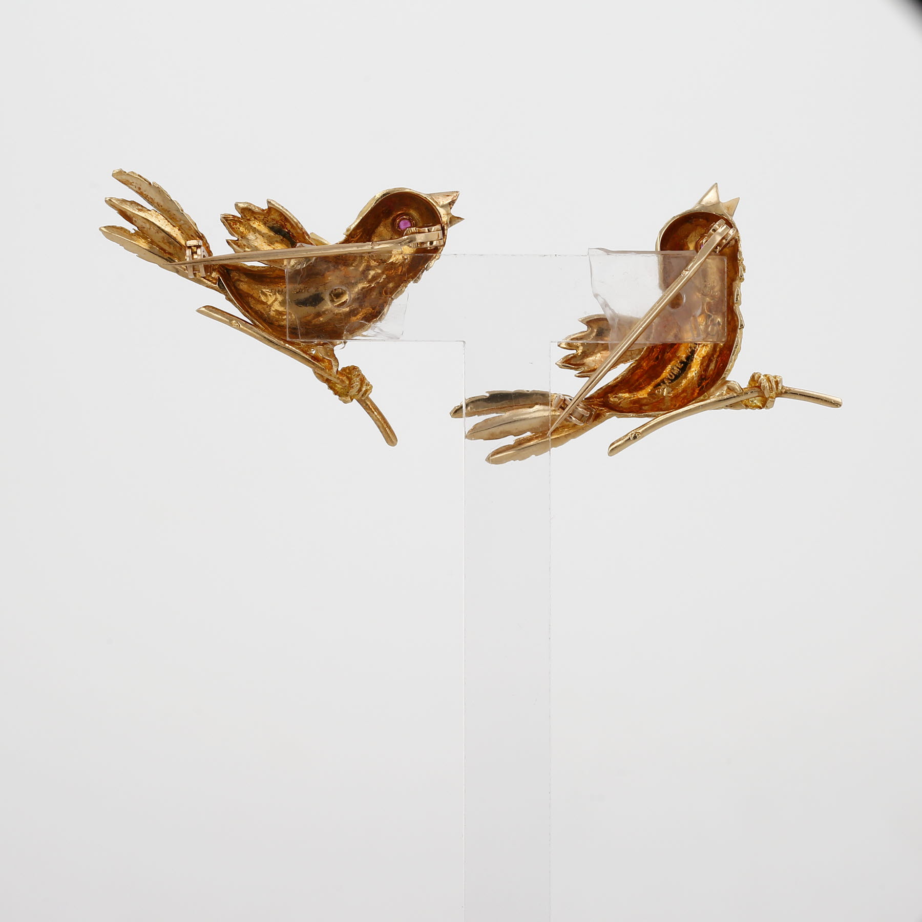 Pair of 1960s Chaumet brooches in yellow gold and rubies